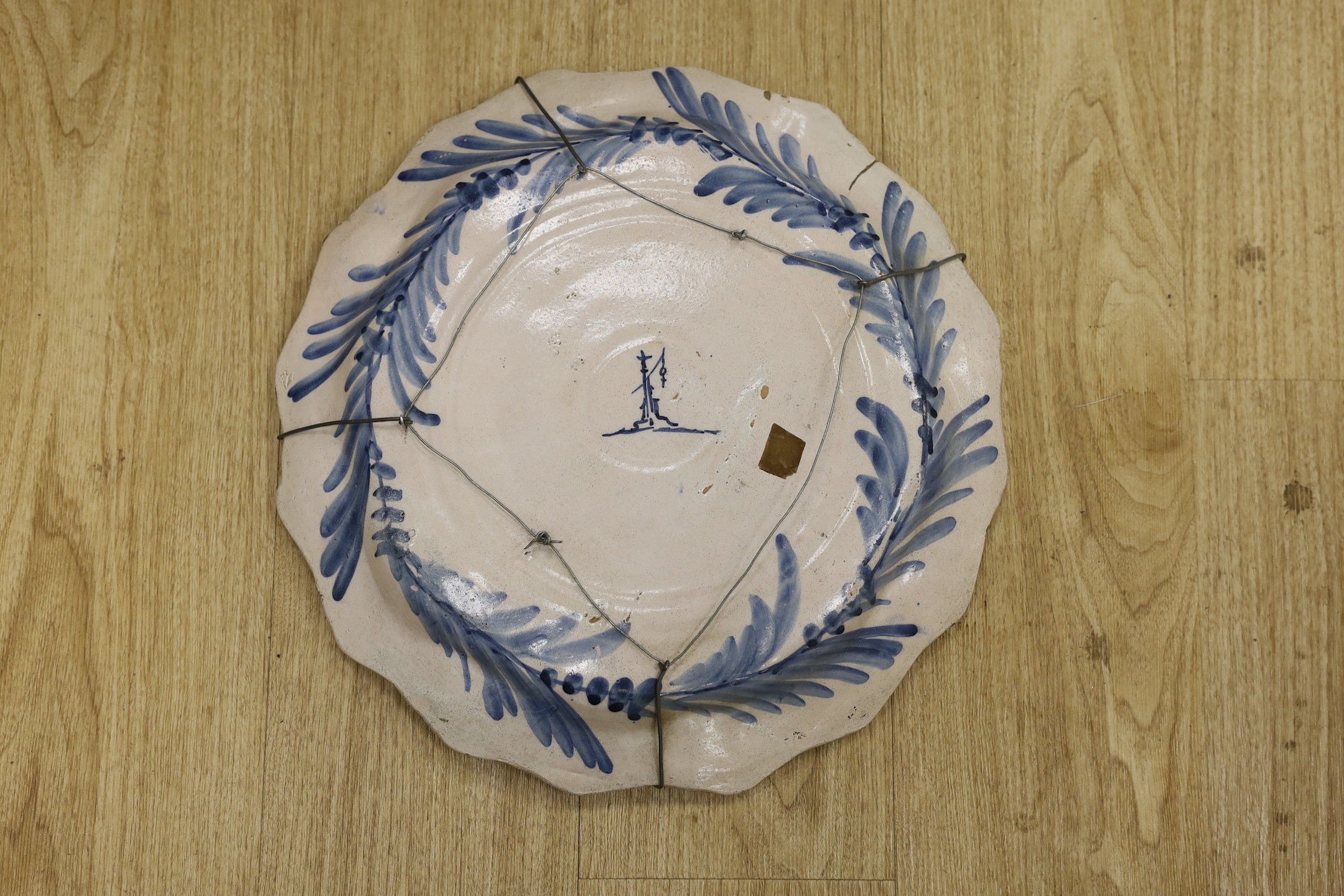 An Italian maiolica armorial dish, Savona, 19th century, hangman mark, 44cm diameter